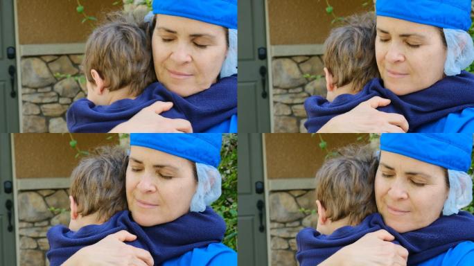 一个小男孩拥抱他的母亲