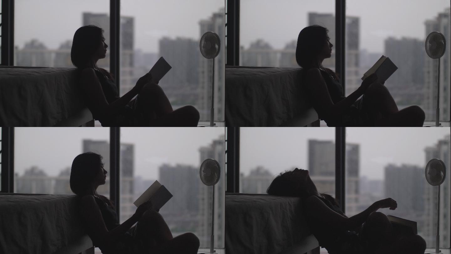 居家女孩在落地窗前看书阅读视频素材