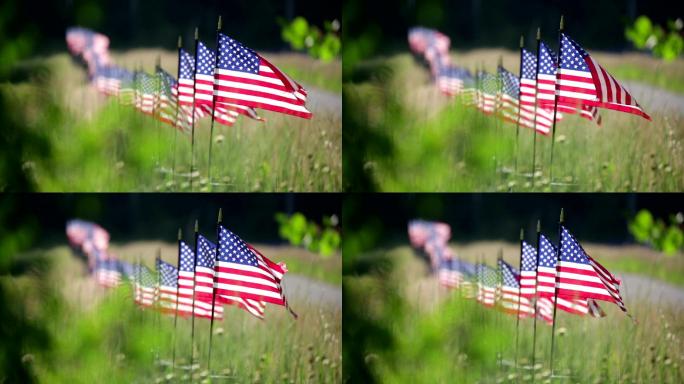 篱笆上的一排美国国旗迎风飘扬