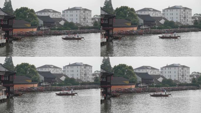 江南水乡湖面上的渔船与渔夫