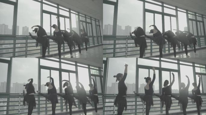 一群女学生舞蹈教室压腿练习