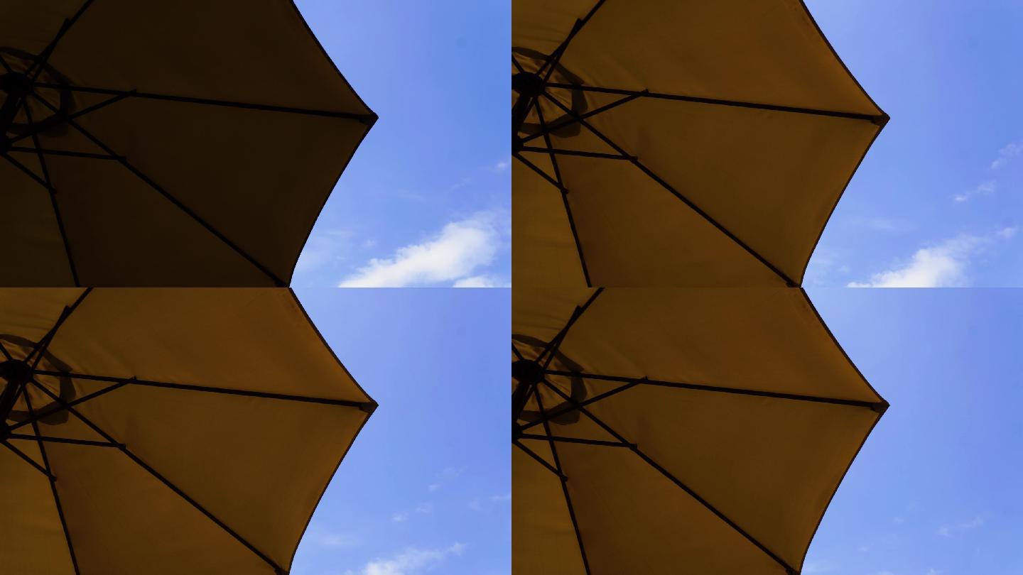 太阳伞下看蓝天白云延时摄影