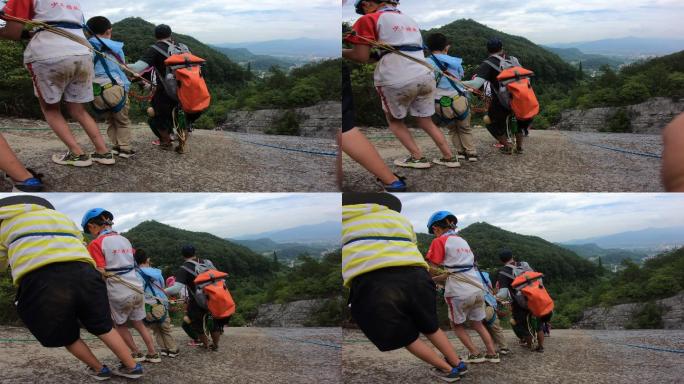 救援教练正在训练小学员做崖降