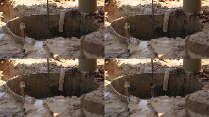 钢丝绳冲击式钻机-钻井口提起泥浆桶