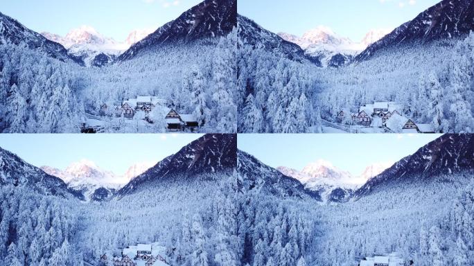 贡嘎山海螺沟雪山森林雪景木屋日出风光空镜