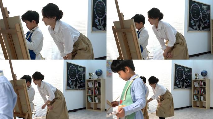 年轻老师辅导孩子们上美术课