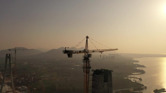 城市 建设 大桥 夕阳 塔吊 航拍 实拍