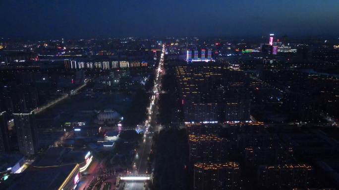 银川无人机航拍夜景湛蓝的天空五彩的街道