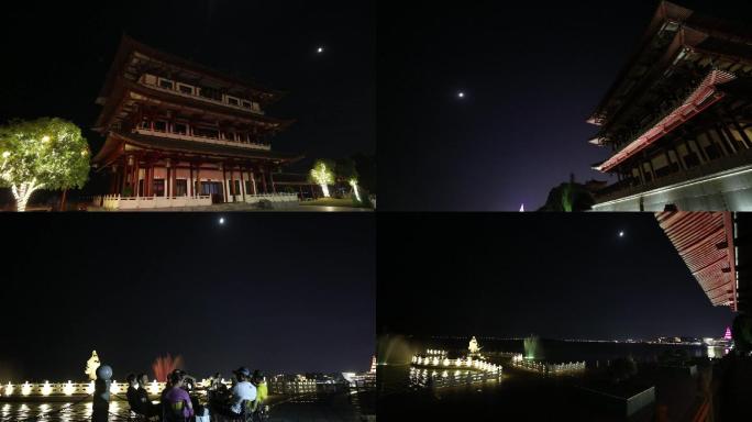 中秋月圆夜色月下湖边阁楼旁家人聚会