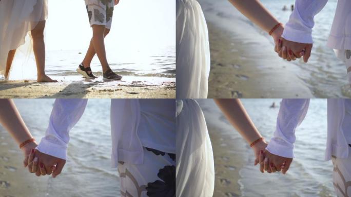 情侣恋人牵手海边散步