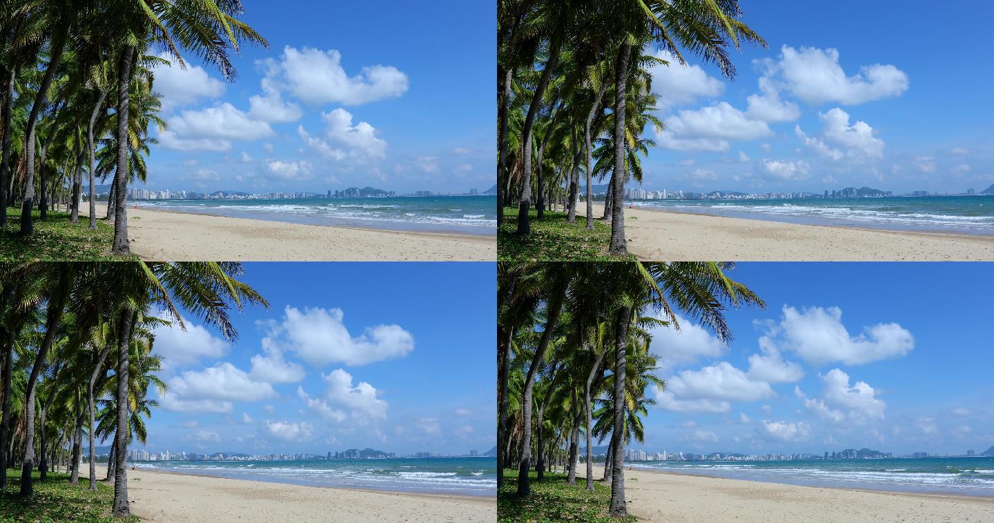 4K实拍海南岛三亚湾海浪蓝天白云椰树