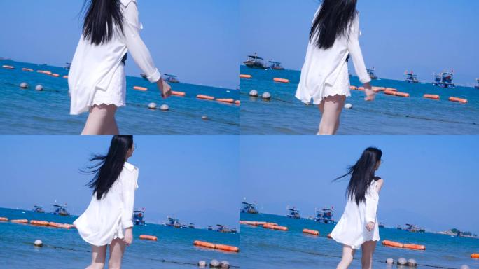 长发女生在海边漫步白衣飘飘视频素材