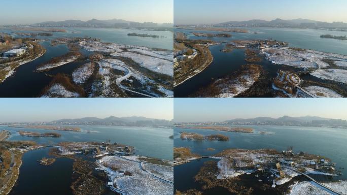 航拍襄阳汉江月亮湾湿地公园城市雪景风光