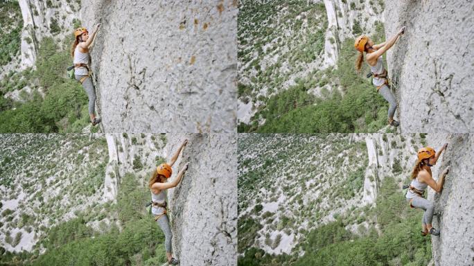 爬上悬崖石壁的女人