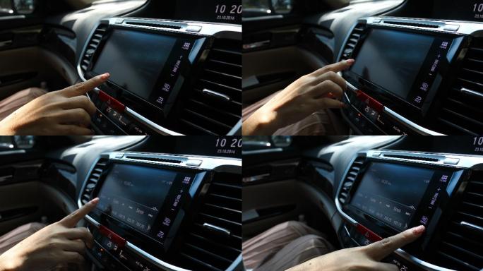 现代汽车中使用仪表板触摸屏的女性