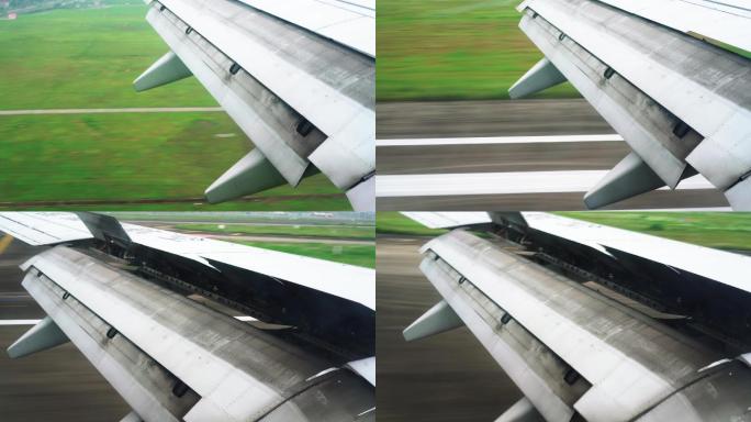 一架飞机正在降落，舷窗视角，降落至跑道