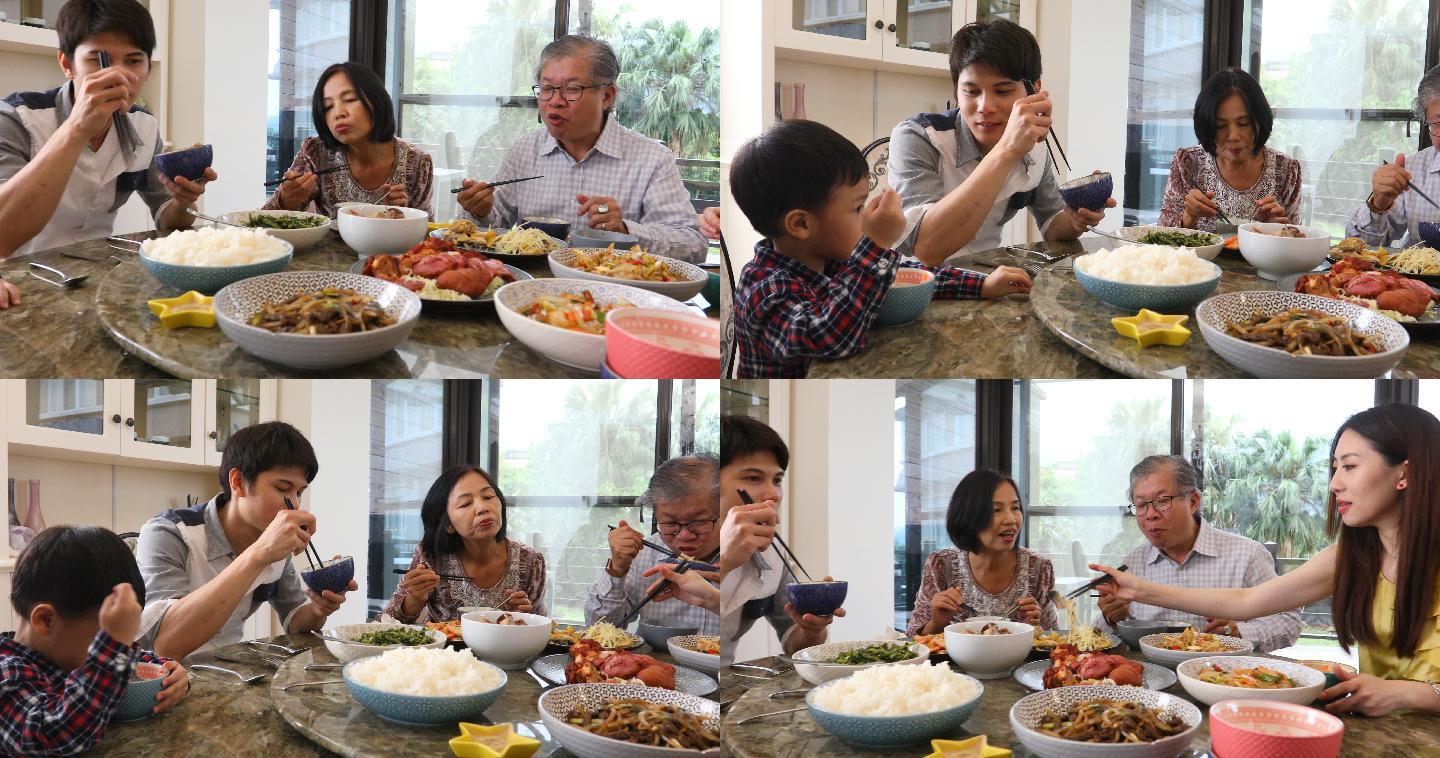 三代亚洲家庭在家吃午餐