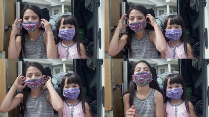 两姐妹戴上口罩视频素材