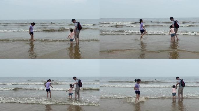 孩子在海边沙滩蹭蹭跳跳出门游玩旅游