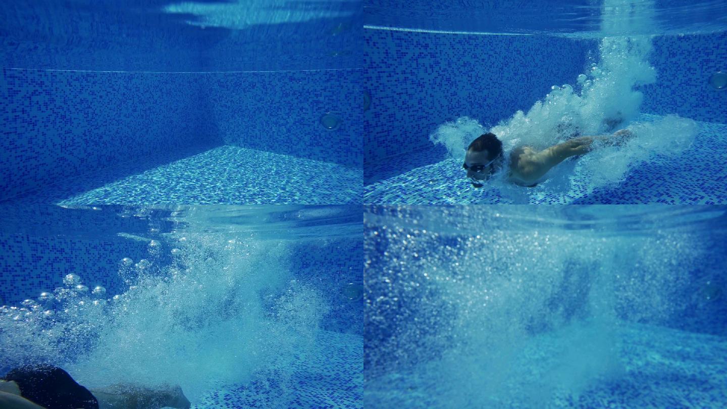 男子潜入游泳池水泳衣水下潜水