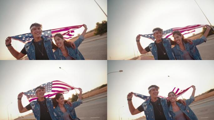 一对年轻夫妇带着美国国旗在公路上跑步