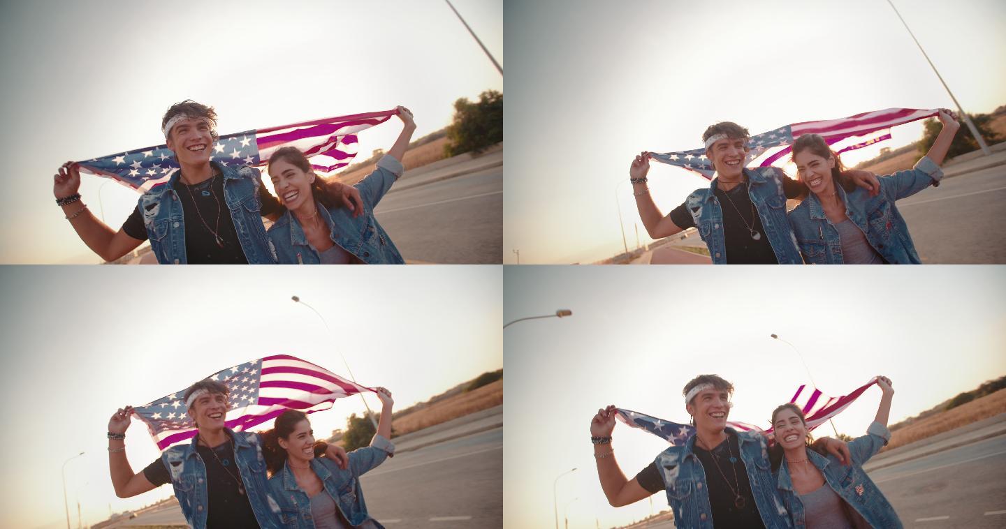 一对年轻夫妇带着美国国旗在公路上跑步