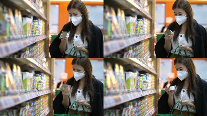 一名年轻女子戴着口罩在超市买干粮
