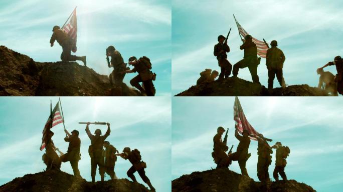 美国士兵举着国旗上山