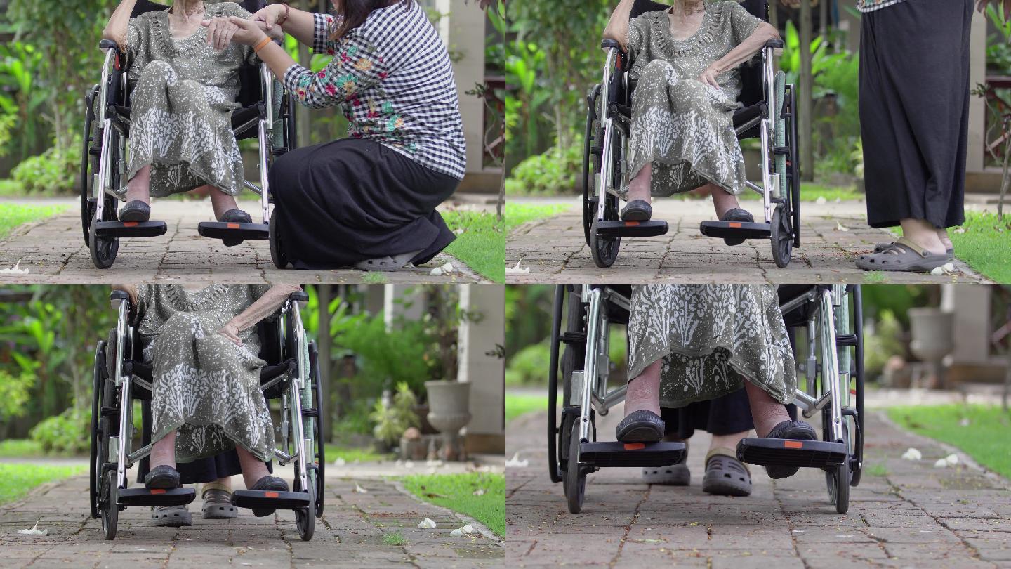 女儿在家照顾坐轮椅的母亲