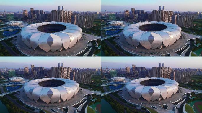 航拍夕阳下的杭州钱江世纪城奥体中心
