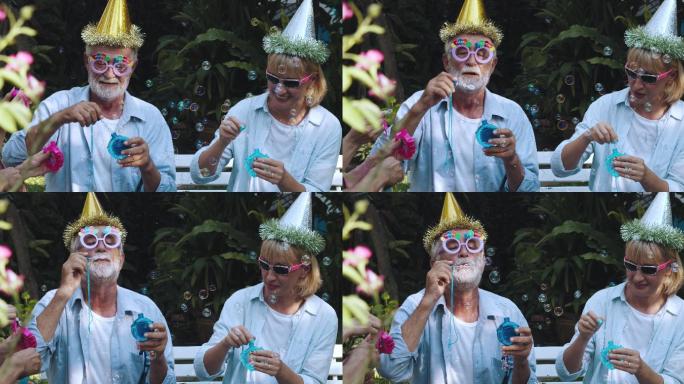 退休社区：在生日派对上戴派对帽的活跃老年人