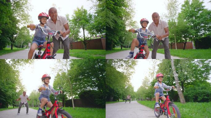 儿子学骑自行车父子运动爸爸教儿子学骑自行