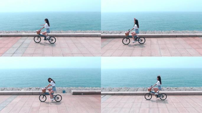 女孩儿海边骑自行车