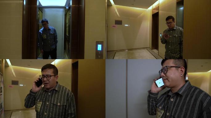 男子出电梯打电话