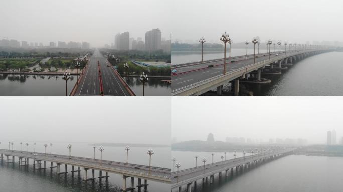 雾中跨河大桥迁安钢城大桥航拍