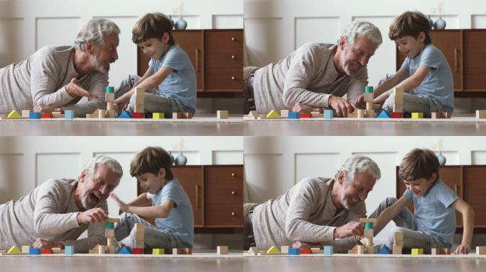 快乐的老爷爷和小孙子玩木块