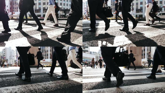 商业人士在人行横道上行走的特写镜头