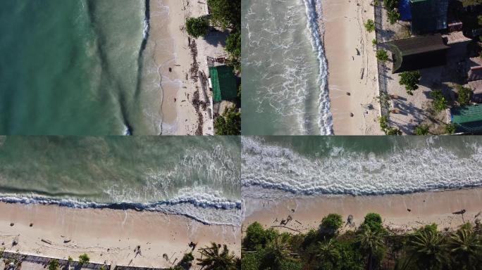 一组海浪拍打到沙滩上的航拍镜头