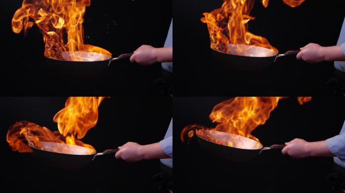 大火炒菜火焰在锅中翻滚升格特写