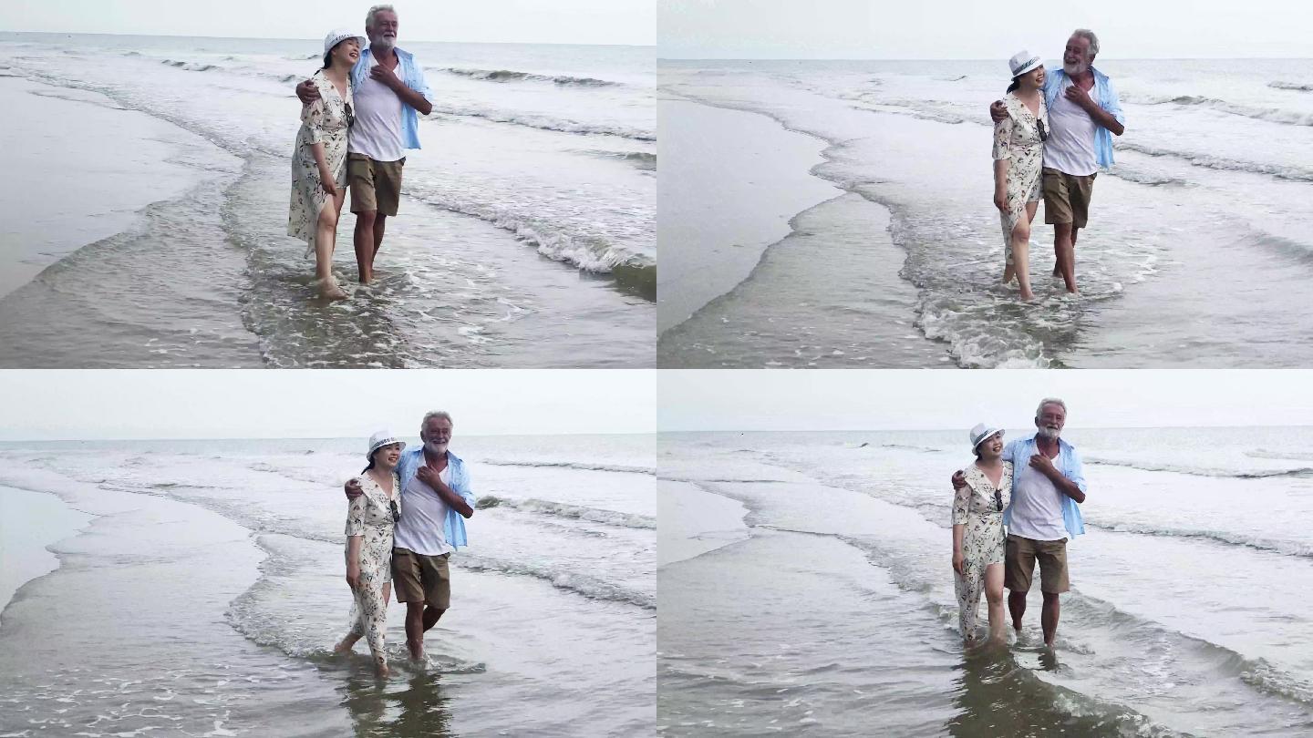老年夫妇在海滩上散步，面带微笑