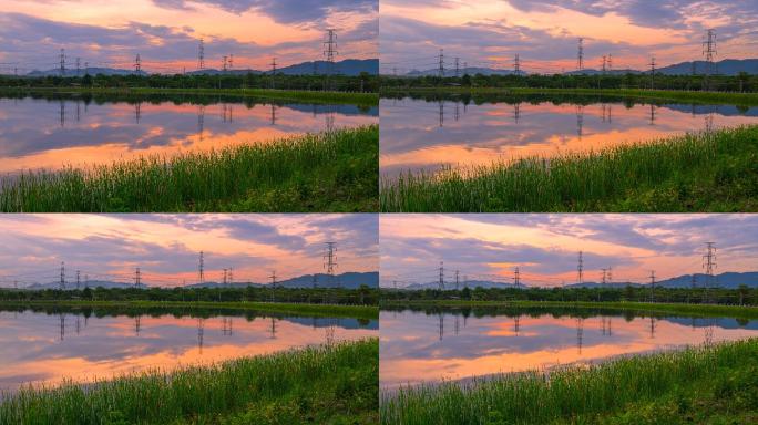 夕阳场景水反射的电力线网时间点