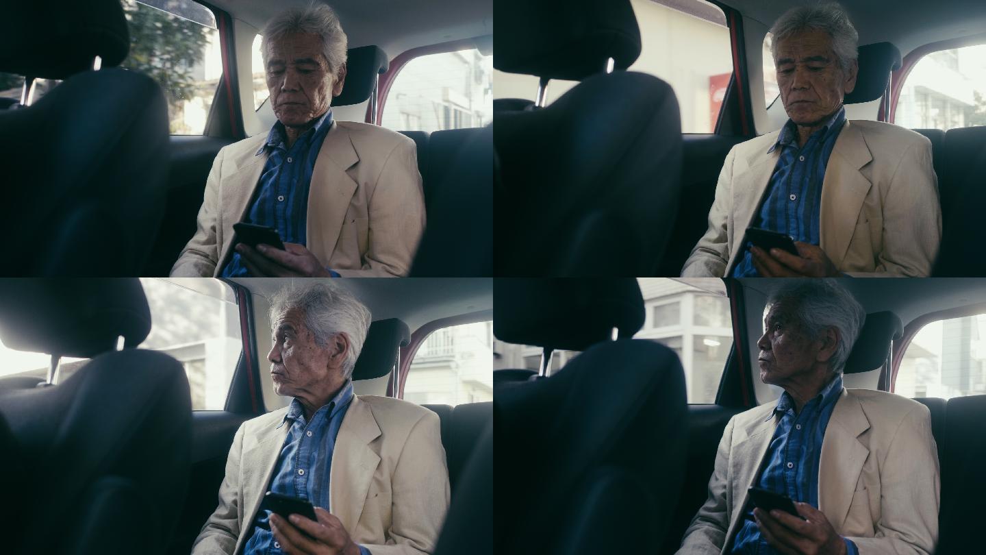 在车上使用手机的老人