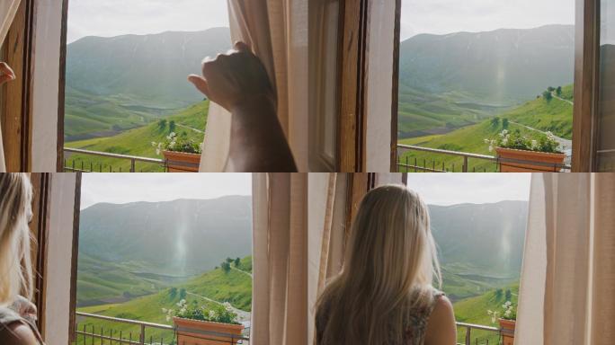 年轻女子拉开酒店窗帘，欣赏阳光明媚的山景