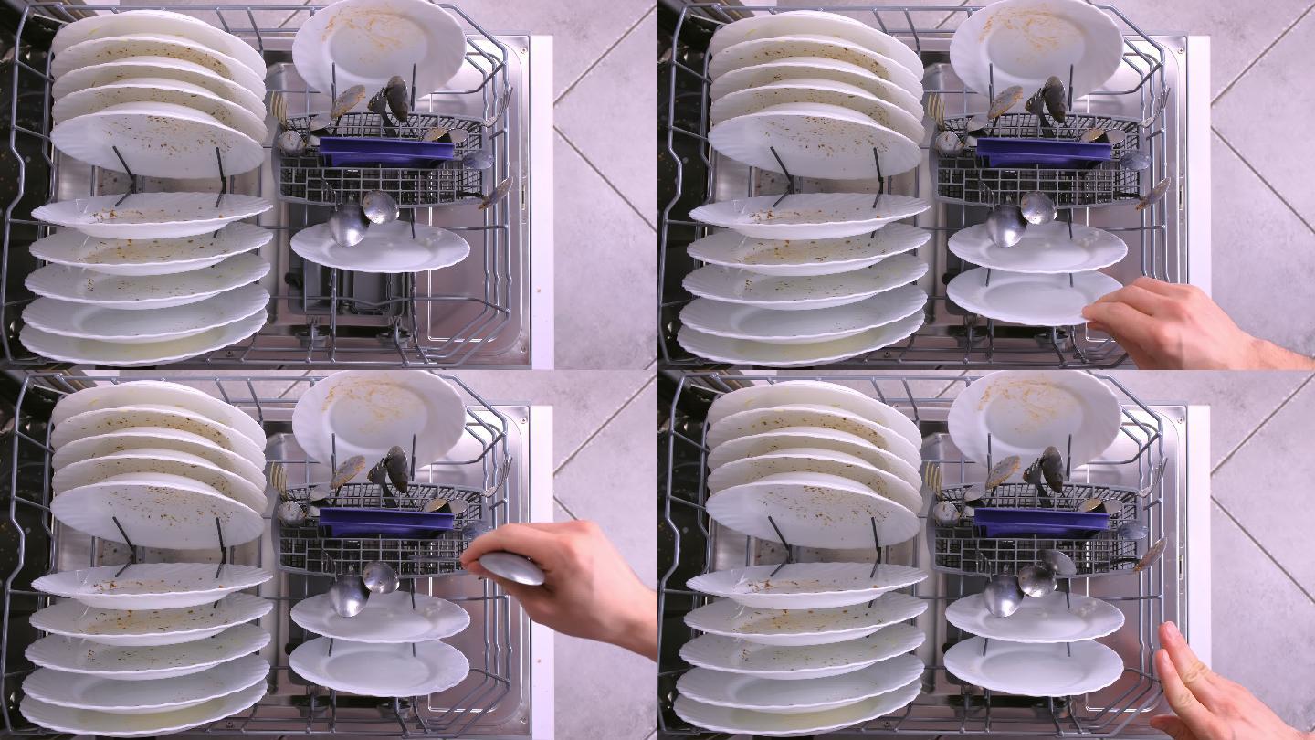 把白色脏盘子和勺子放进洗碗机