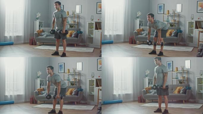 健身男士在家里用哑铃做运动
