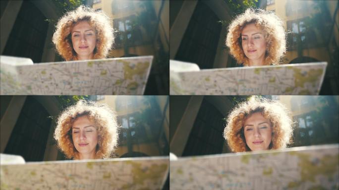 一位正在看城市地图的女游客。