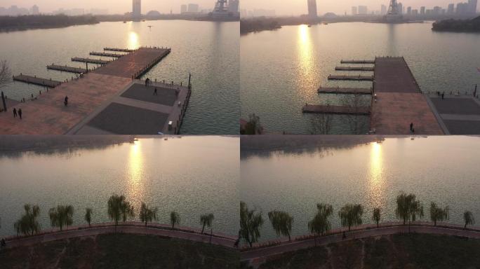 近距离拍摄落日下的焦作龙源湖公园