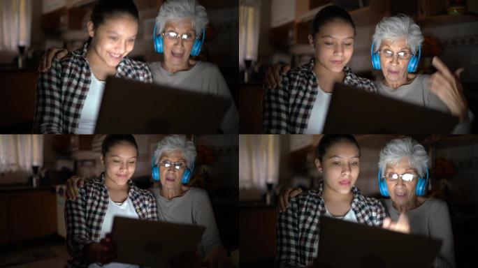 孙女和祖母在家里进行视频通话