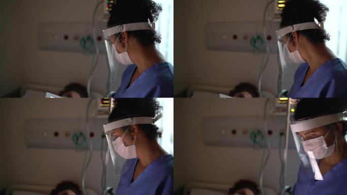 带口罩的医生和病人在病房交流