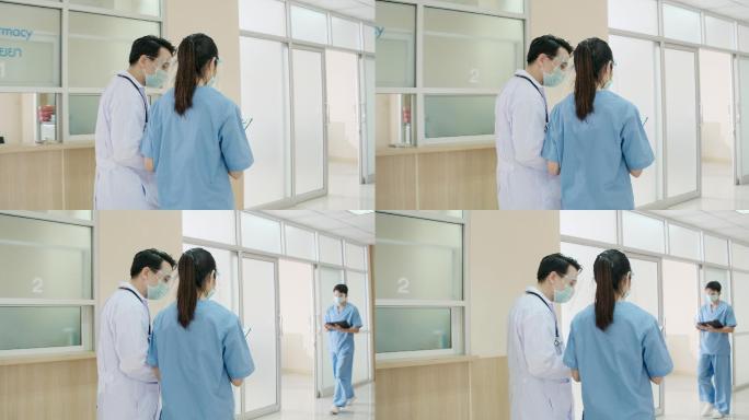 在医院走廊，医生边走边谈。